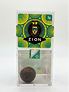A clear plastic container with a colorful label featuring a lion wearing sunglasses and a crown, the word "ZION," and a small dark round object inside.

Description generated by AI